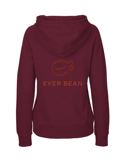 Neutral, Hoodie, Dame fra Neutral er en rødbrun fairtrade hættetrøje i bomuld, med en stor frontlomme og hætte. Bagsiden har et brunt kaffebønne-logo med nummer 3 og "EVER BEAN"-teksten under, hvilket giver et etisk og stilfuldt look.